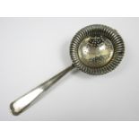 A 19th Century Norwegian white metal tea strainer, the terminal engraved Erindring af 28/3=72, LNR