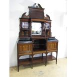 An impressive late 19th / early 20th Century rosewood mirror-backed display cabinet, the base