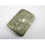 A Victorian silver cigarette case, of typical form, contoured to the body and elaborately chased and