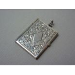 A novelty silver stamp box fob in the form of a book, engine turned and foliate engraved