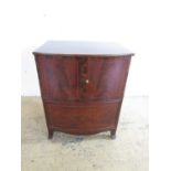 A George III string-inlaid and cross-banded mahogany bow-fronted chest commode