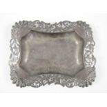 A Victorian silver dish, of cusped rectangular shape with canted corners, surrounded by a