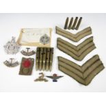 A group of Great War and Second World War military insignia and artefacts including an enamelled