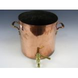 A 19th Century copper boiling pan with brass tap, 31 cm