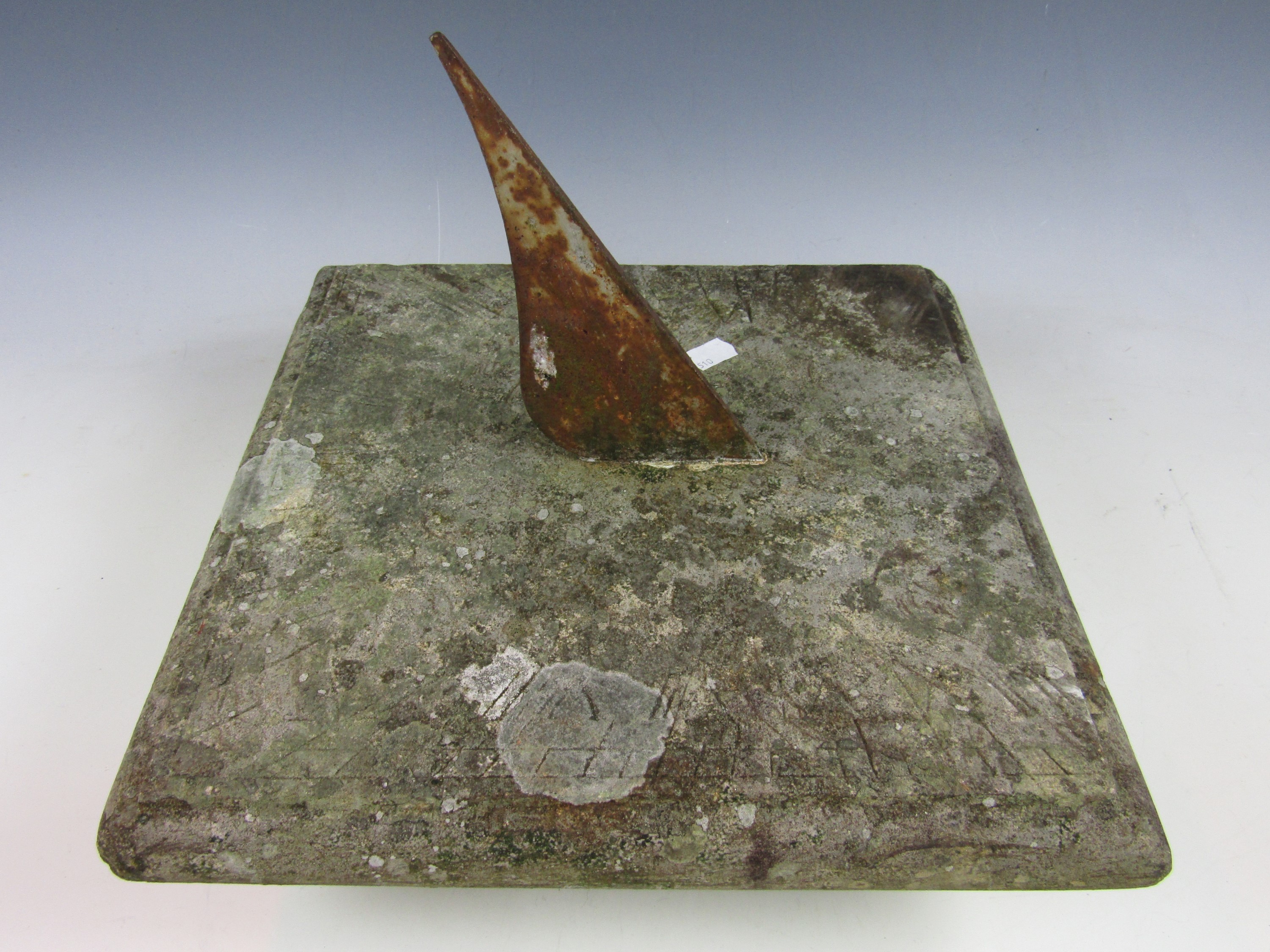 An antique carved stone sundial with later gnomon, 35 x 35 x 30 cm high