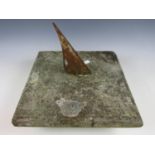 An antique carved stone sundial with later gnomon, 35 x 35 x 30 cm high