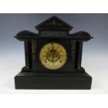 A late Victorian black slate architectural mantle clock, 33 cm