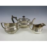 A Victorian silver tea set, of Georgian shape, comprising tea pot, sugar and milk, Sheffield,