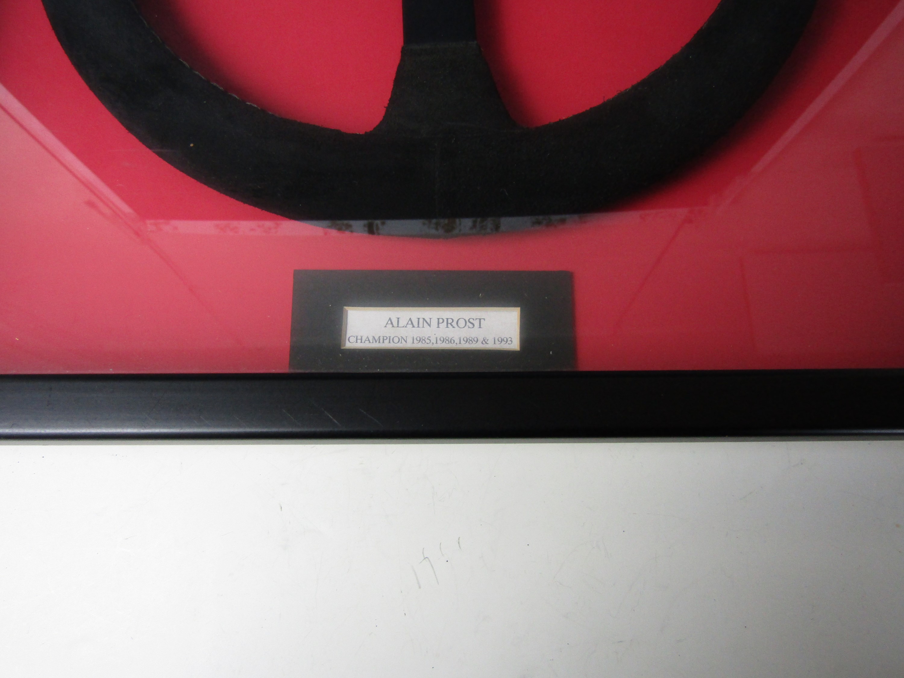 A framed replica Formula 1 steering wheel signed by Alain Prost - Image 2 of 3