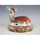 A Royal Crown Derby Collectors' Guild bone china 'Deer' paperweight designed by John Ablitt, with