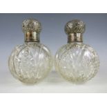A pair of Victorian silver mounted and cut glass grenade-form perfume bottles, each with an oblate-