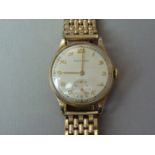 A 1950s Movado 9ct gold wrist watch, having a 15 jewel manual-wind movement, and silvered face