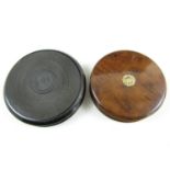 A 19th Century turned ebony snuff box together with a fruit wood example