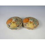 A pair of Charlotte Rhead for Bursley Ware covered boxes, of circular section, tube lined with