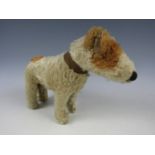 A 1920s Chad Valley Hygienic Toys dog, with rotating head and collar, 23 cm