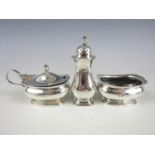 A George V silver cruet set, comprising baluster pepperette, mustard and salt (liner lacking),