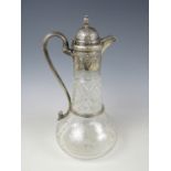 A Victorian silver-mounted cut glass claret jug, of baluster form, the mounts comprising a hinged