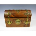 A Victorian walnut stationery box, having a vaulted lid and decorated with brass escutcheons and