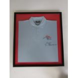 A framed polo shirt from the 1997 Formula 1 Grand Prix signed by Giancarlo Fisichella