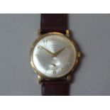 A 1960s Strad 9ct gold wrist watch, having a 17 jewel manual wind movement with radially-brushed