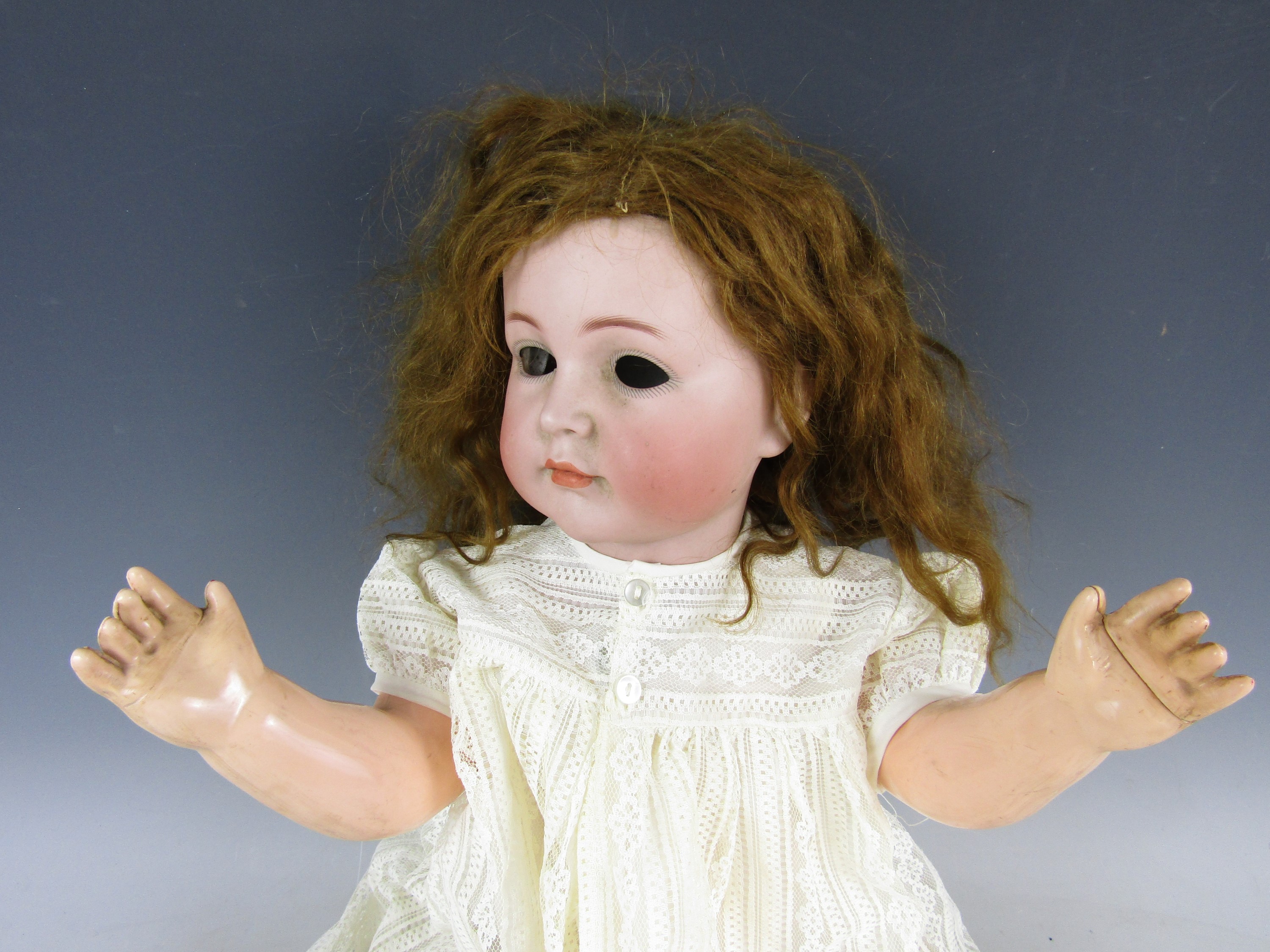 A Kammer & Rheinhardt character child doll Mein Liebling, with bisque socket head, feathered