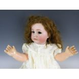 A Kammer & Rheinhardt character child doll Mein Liebling, with bisque socket head, feathered