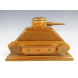 A 1940s novelty wooden cigarette dispenser modelled as a tank, 25 cm x 18 cm x 16 cm high