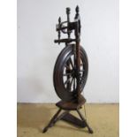 A 19th Century wooden spinning wheel, 98 cm