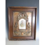 A Great War bronzed plaster memorial plaque within oak frame, 56 cm x 46 cm