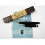 A vintage Parker Duofold fountain pen in black, with 14K gold nib, in original box with paperwork