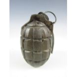 An inert 1916 No 5 (Mills) grenade