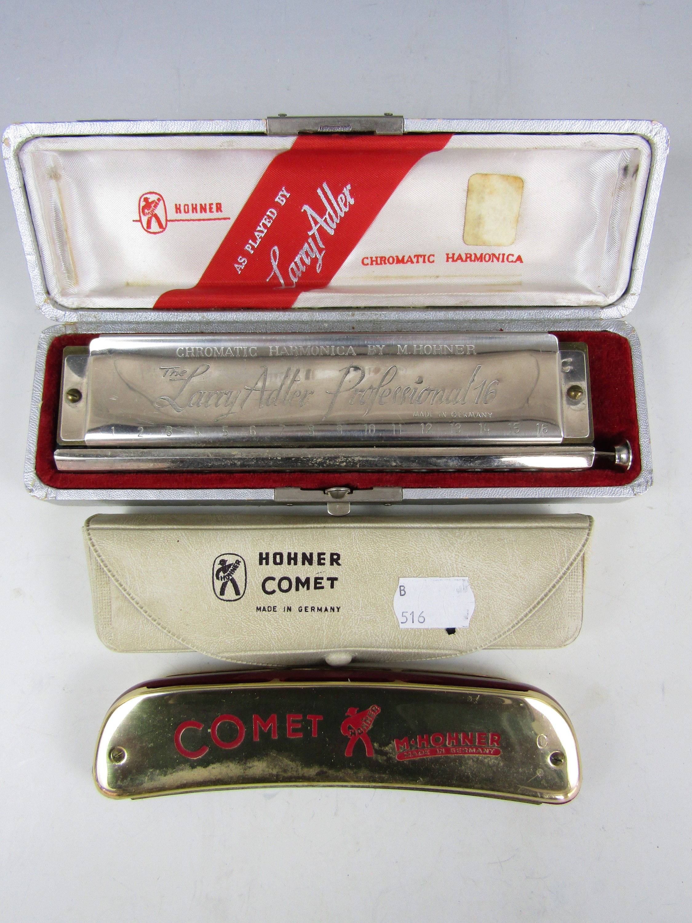 A boxed Hohner Larry Adler Professional 16 chromatic harmonica, together with a Hohner Comet (2)