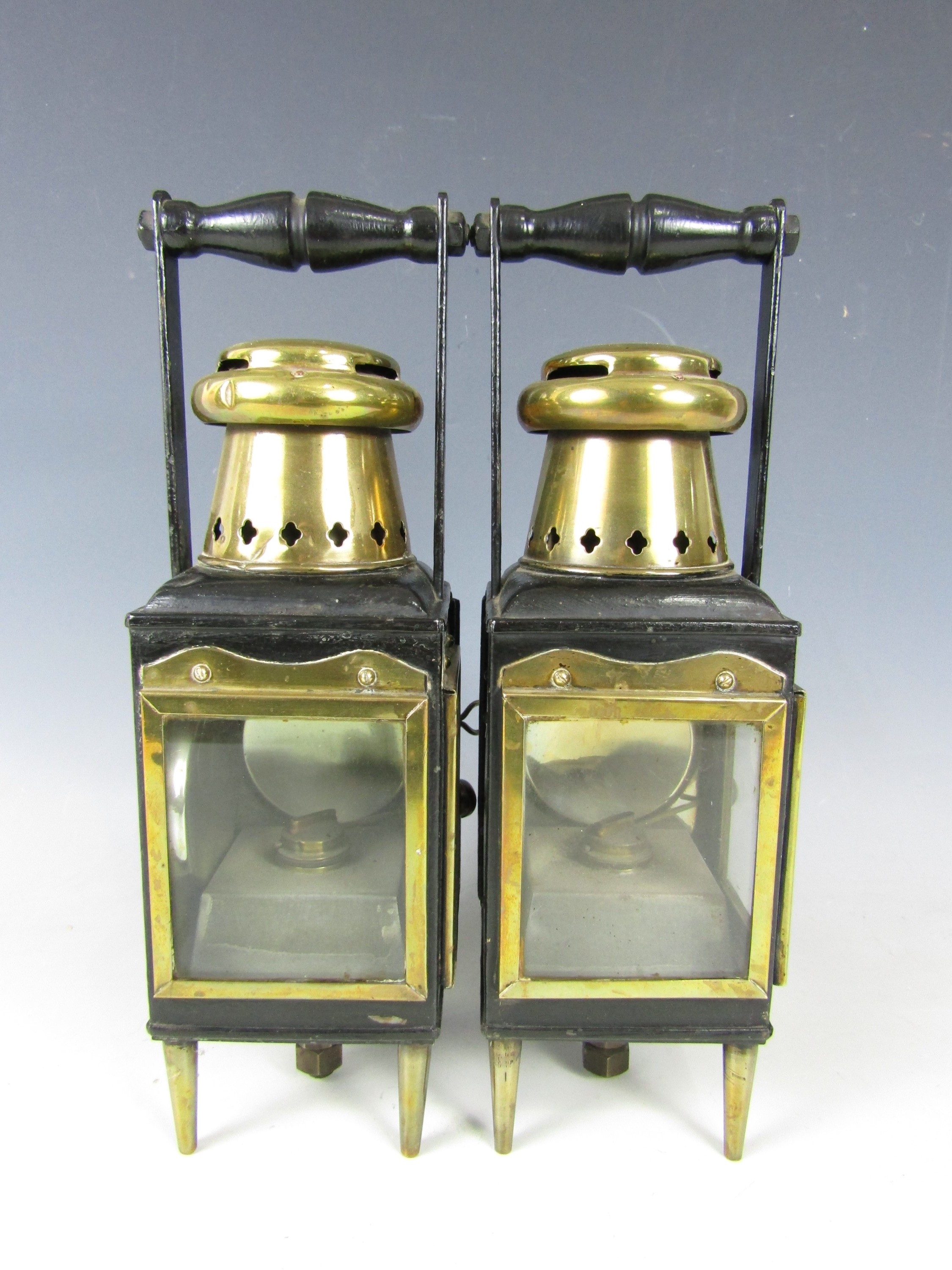 A pair of Victorian brass and iron railway or carriage lanterns, 36 cm