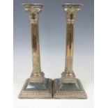 A pair of WMF electroplate neo-classical columnar candlesticks, late 19th / early 20th Century, 31