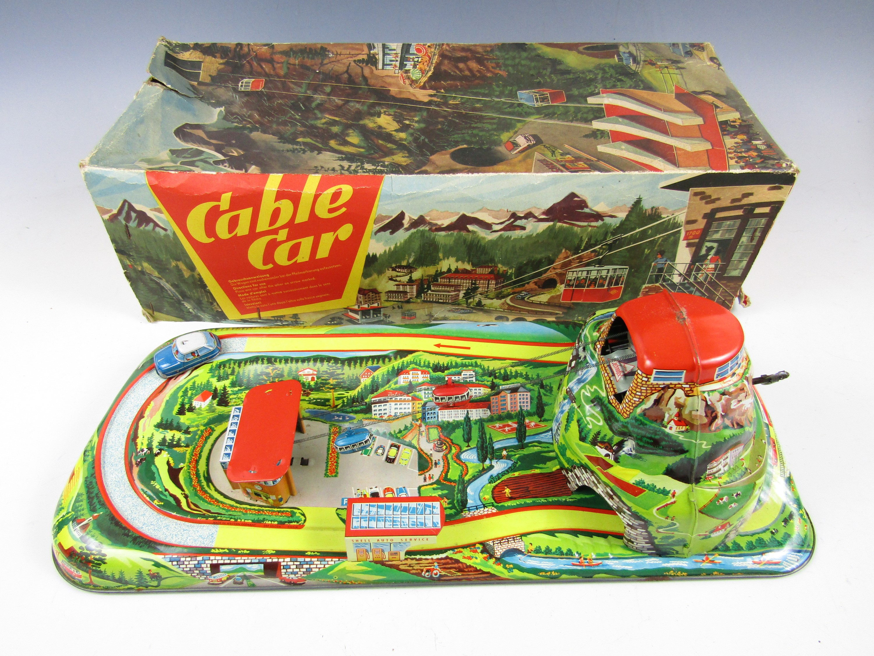 A West German Technofix 303 tinplate Mechanical Cable Car set, with clockwork gondolas and one
