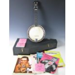 A Ron Beddoes 'New Concert' ukulele banjo, with case and a quantity of period sheet music