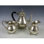 An early 20th Century continental white metal tea/coffee service, comprising pot, milk jug and