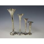 Four various silver trumpet vases, tallest 21.5 cm