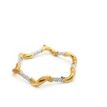 Gold and white gold bracelet Pulsera ondulada semirrígida en oro bicolor. Long.: 19 cm. Stat