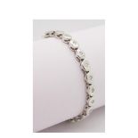 White gold, emeral and diamonds bracelet