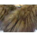 Fur stole together with a box containing a quantity of various other fur stoles etc and a ladies