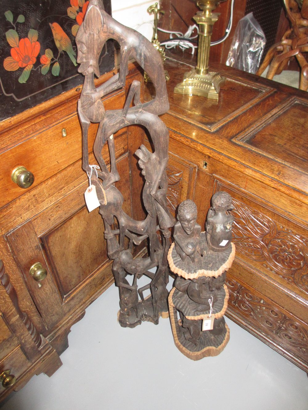 Mid 20th Century African carved hardwood figural group together with another similar
