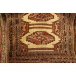 Pair of small Indo Persian rugs with repeating gol designs on beige ground with borders together