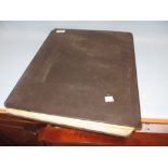 Large black album containing an extensive collection of World stamps