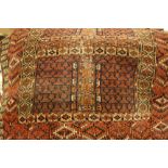 Turkoman prayer rug with panelled Mihrab design within a multiple border,