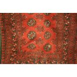 Afghan style rug having red ground, 1.92m x 1.