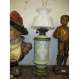 Pate sur pate style porcelain and gilt brass mounted oil lamp,