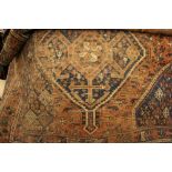 Shiraz rug with double pole medallion design (cut and worn)