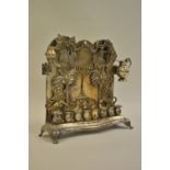 Polish silver hanukkah oil lamp decorated in high relief with lions, trees,