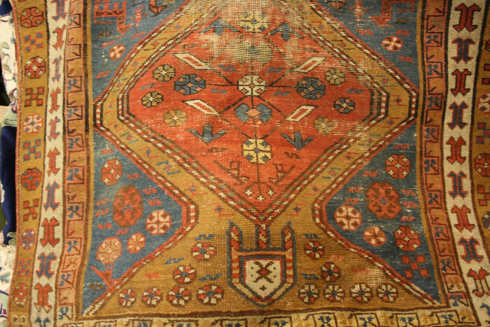 Kurdish rug with triple medallion and multiple borders (worn) together with a small Pakistan